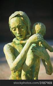 Close-up of the sculpture of a woman with her baby