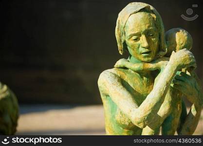 Close-up of the sculpture of a woman with her baby