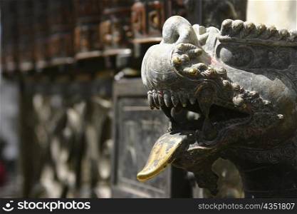 Close-up of the statue of a lion outside a temple, Swayambhunath, Kathmandu, Nepal