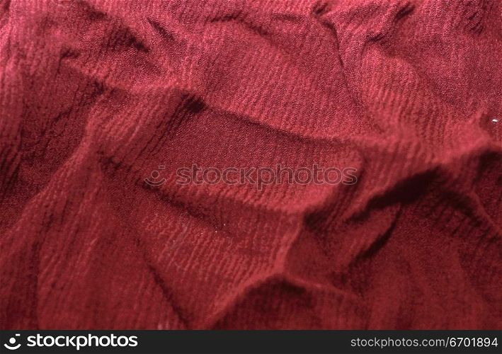 Close-up of the surface of red fabric