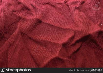 Close-up of the surface of red fabric