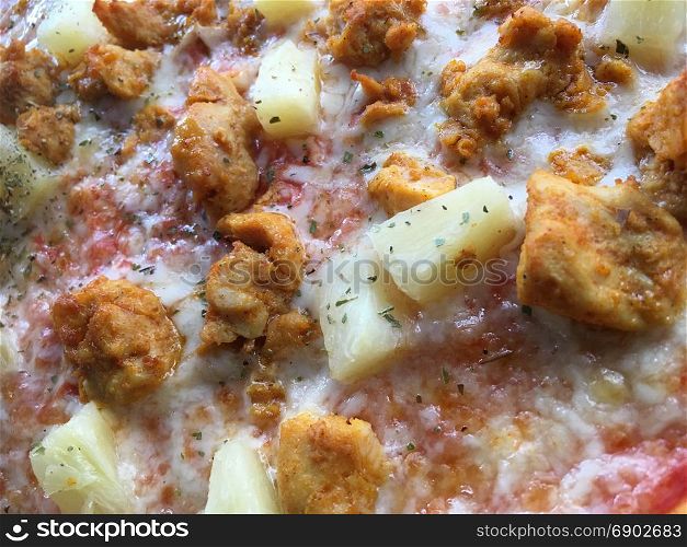 Close up of the toppings on an Hawaiian Pizza
