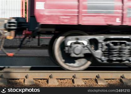 close - up of the train wheel in motion on the railway. passenger train on the railway