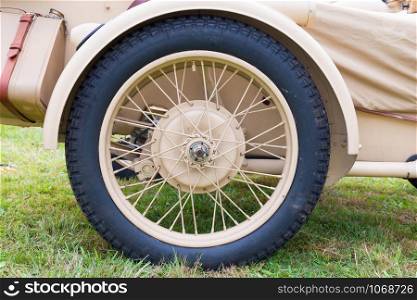 close up of the wheel and tire of a military sidecar
