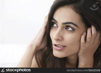 Close-up of thoughtful young woman looking at copy space