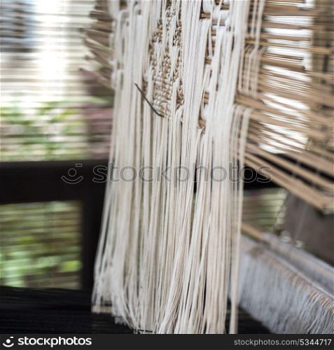 Close-up of threads hanging in a loom, Luang Prabang, Laos