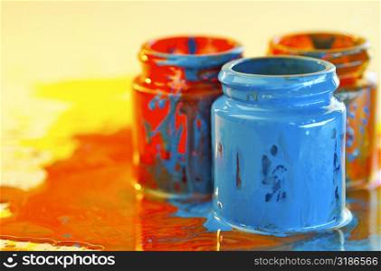 Close-up of three bottles of paint