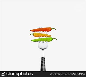 close up of Three chilies pierced by fork, isolated on white background
