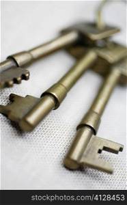 Close-up of three keys on a key ring