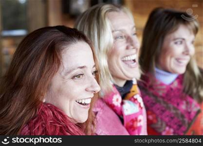 Close-up of three mature women smiling