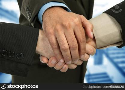 close up of three men hands together in a deal, studio picture