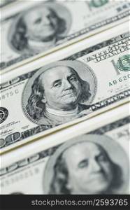 Close-up of three one hundred dollar bills