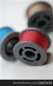 Close-up of three spools of thread