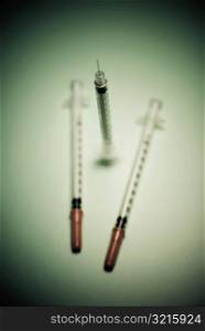 Close-up of three syringes