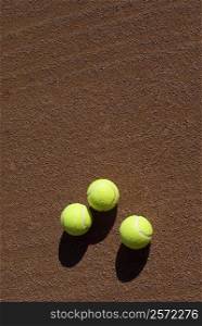 Close-up of three tennis balls