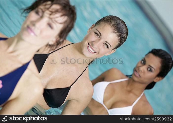 Close-up of three young women in a swimming pool
