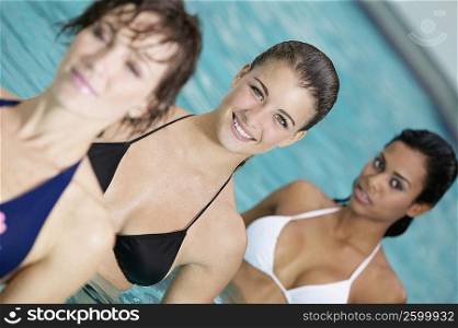 Close-up of three young women in a swimming pool