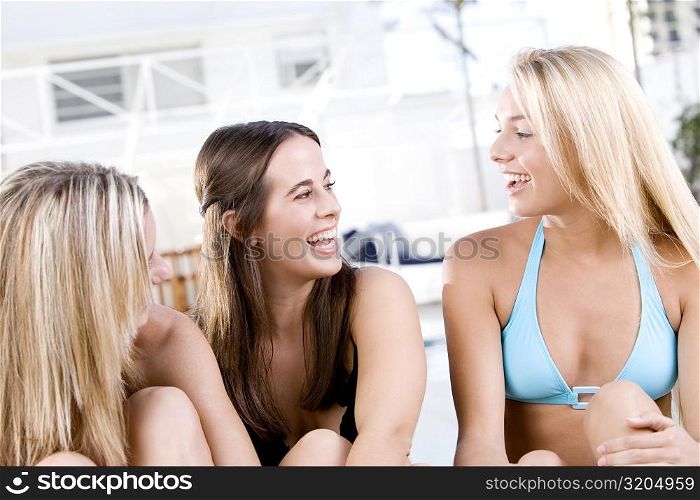 Close-up of three young women laughing