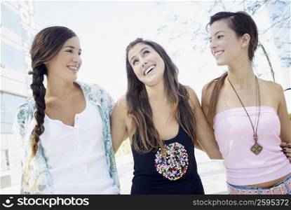 Close-up of three young women smiling