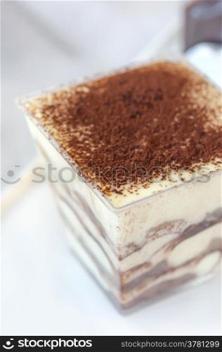 close up of Tiramisu cake in a glass