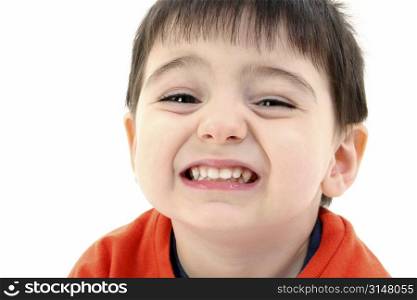Close up of toddler boy smiling. Wearing orange casual shirt.