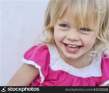 Close up of toddler girls smiling face