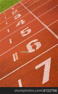 Close-up of track numbers on a running track