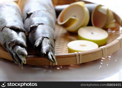 Close up of two bamboo shoot on burlap background, popular Vietnam vegetable in rainy season