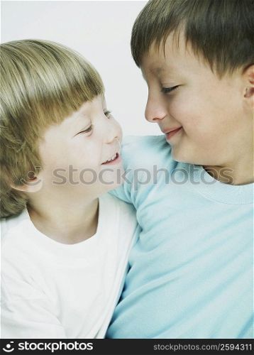 Close-up of two boys looking at each other