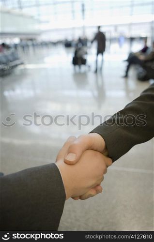 Close-up of two business executives shaking hands