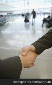 Close-up of two business executives shaking hands