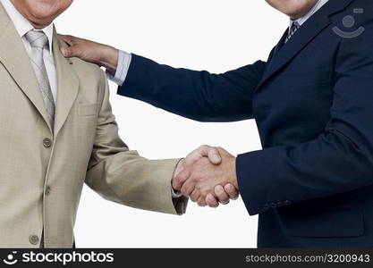 Close-up of two businessmen shaking hands