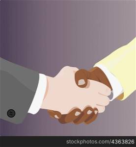 Close-up of two businessmen shaking hands