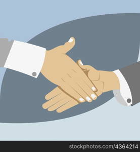 Close-up of two businessmen shaking hands