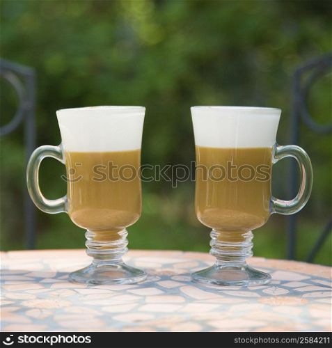 Close-up of two coffee cups on a table
