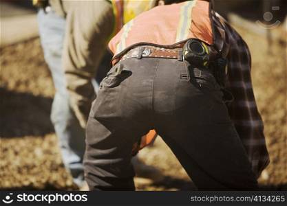 Close-up of two construction workers working at a construction site