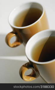 Close-up of two cups of black tea