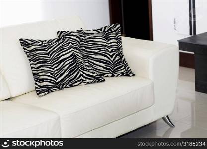 Close-up of two cushions on a couch