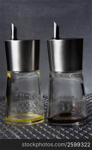 Close-up of two empty perfume bottles