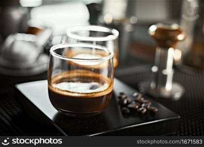 Close up of two espresso in shot glasses. . Close up of two espresso