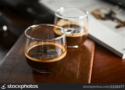 Close up of two espresso in shot glasses. . Close up of two espresso 