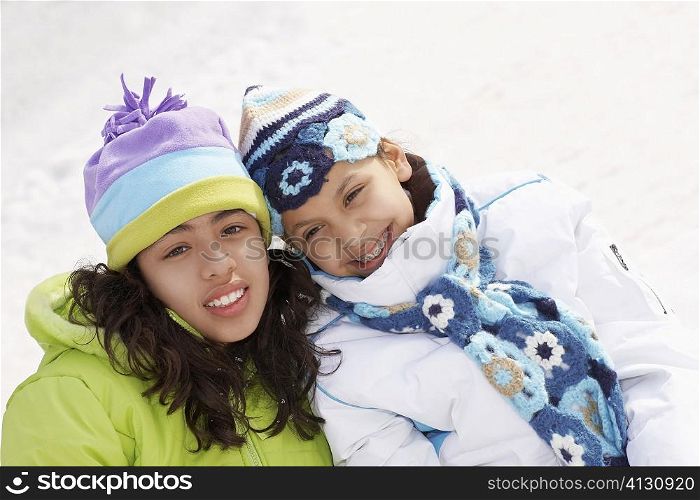 Close-up of two girls smiling