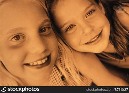 Close up of two girls smiling