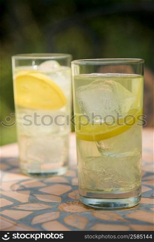Close-up of two glasses of lemonade on a table