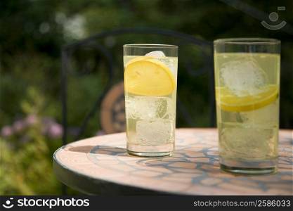 Close-up of two glasses of lemonade on a table