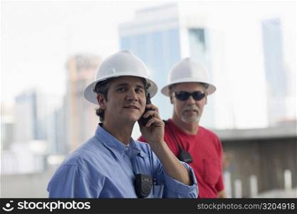 Close-up of two male construction workers at a construction site