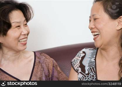 Close-up of two mature women smiling