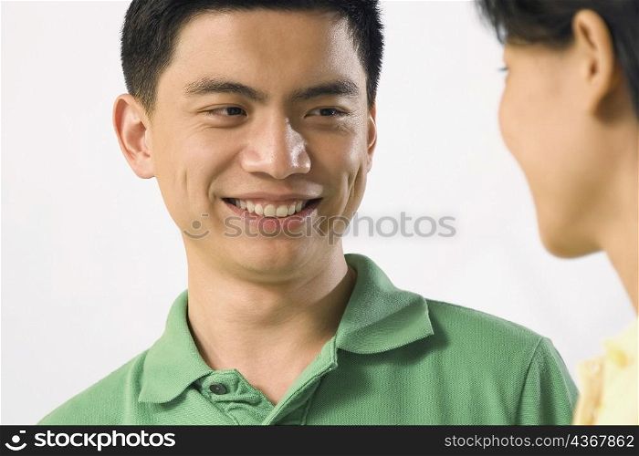 Close-up of two office workers smiling