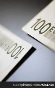Close-up of two one hundred Euro banknotes
