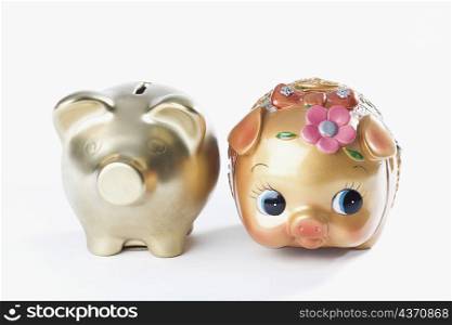 Close-up of two piggy banks